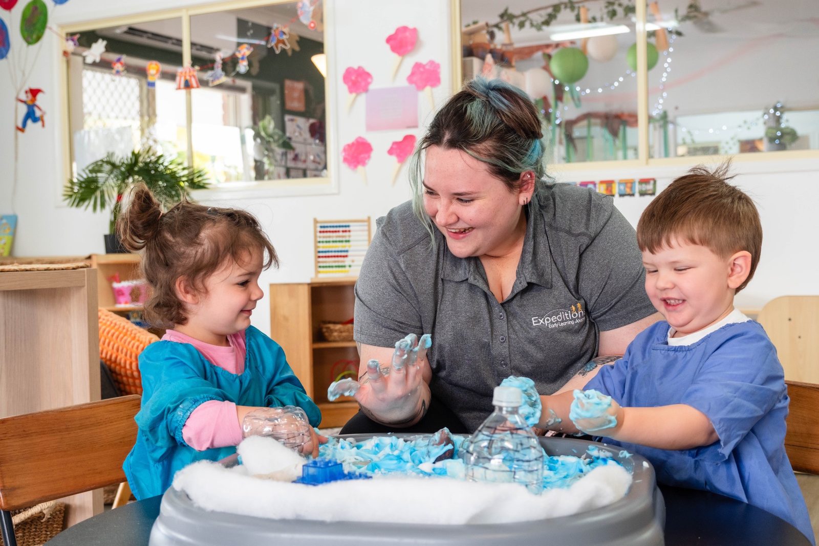 An educator and children enjoying sensory play at Expeditions Avoca