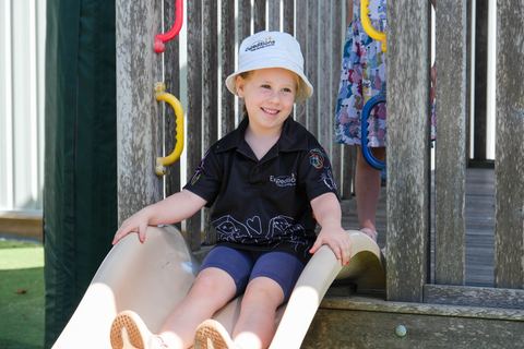 A child on an outdoor slide at Expeditions Avoca