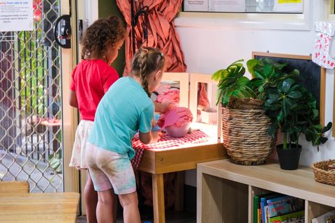 Children exploring an indoor play kitchen at Expeditions Avoca