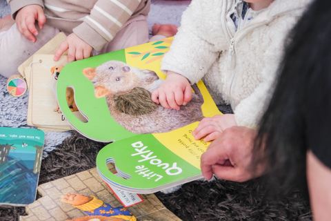Hands exploring a sensory activity with shaped mats at Expeditions Narre Warren
