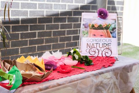 Natural materials and a book arranged for a learning invitation at Expeditions Narre Warren