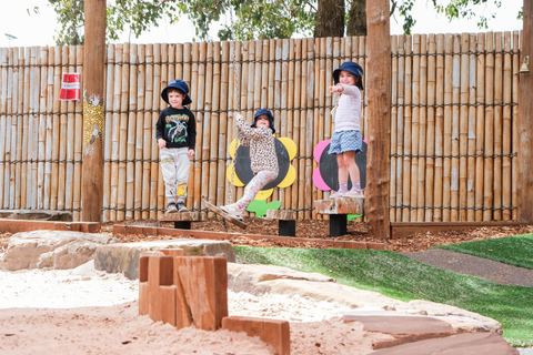 Children exploring an outdoor play space at Expeditions Narre Warren