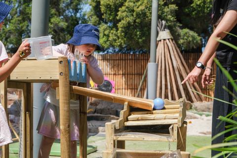 A child playing with an outdoor musical instrument at Expeditions Narre Warren