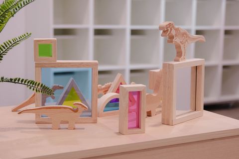 Wooden play materials and colourful framed artwork at Expeditions Raceview 2