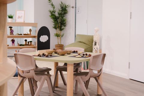 A child-height table with chairs in a learning room at Expeditions Raceview 2