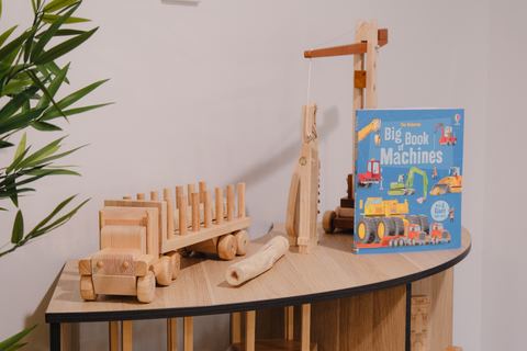 Books and wooden play materials on a table at Expeditions Raceview 2