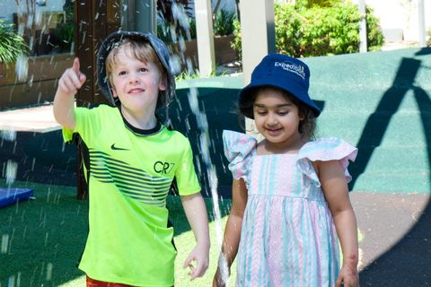Children enjoying an outdoor water feature at Expeditions Underwood