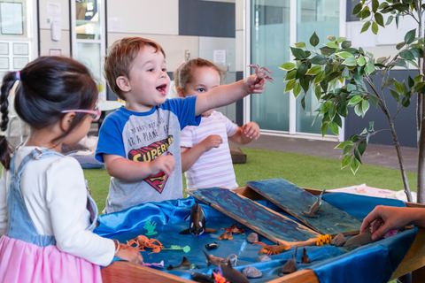 Children exploring a water and sensory tray at Expeditions Underwood