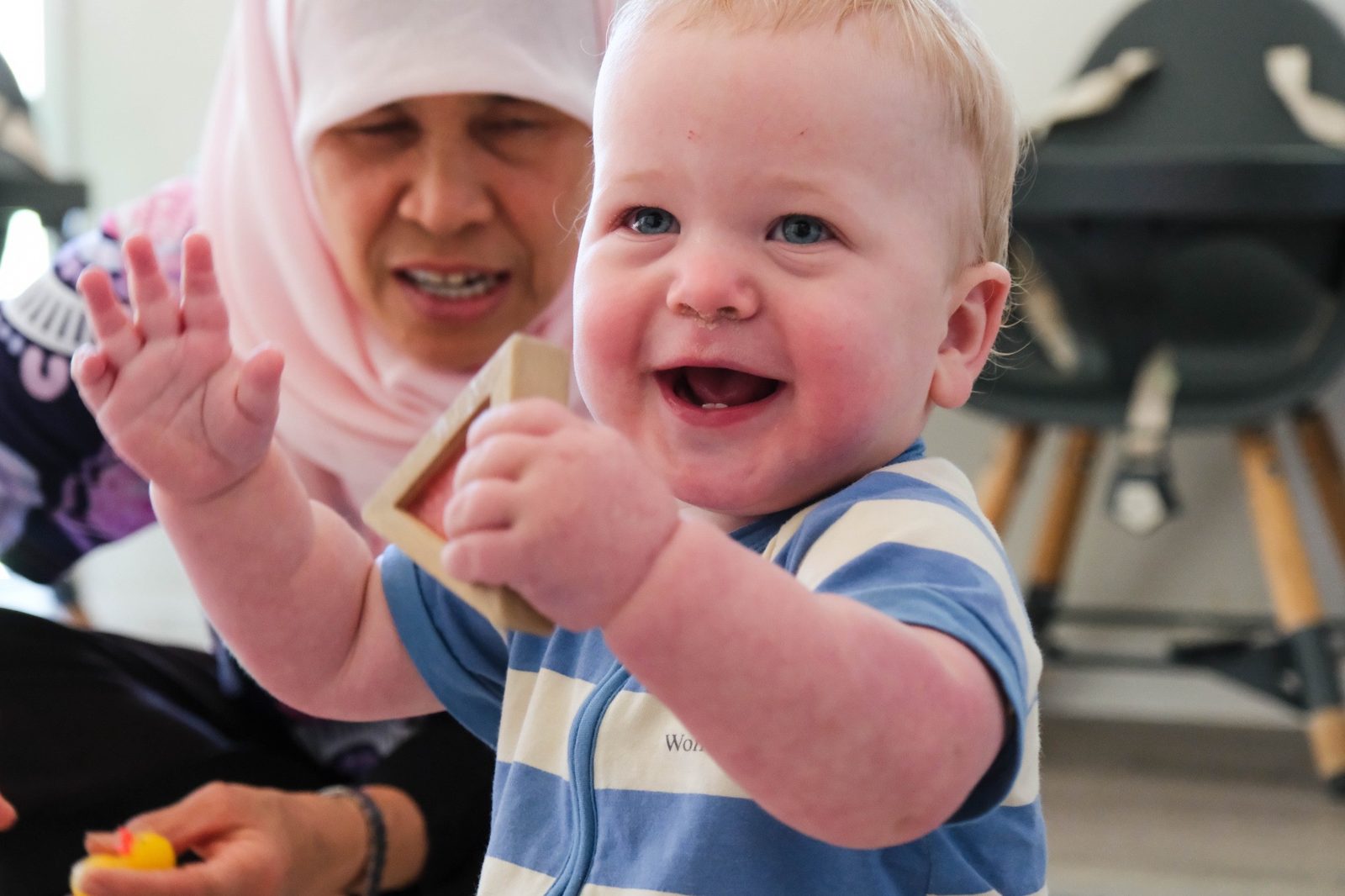 A child and educator connecting at Expeditions Raceview
